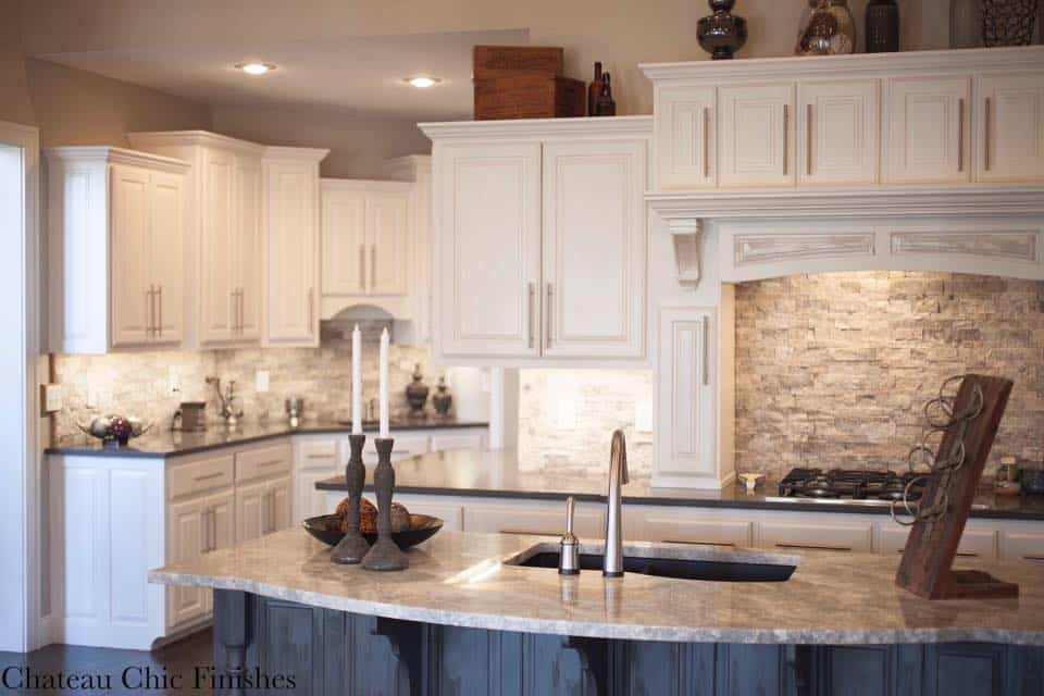 White painted kitchen cabinets with grey island