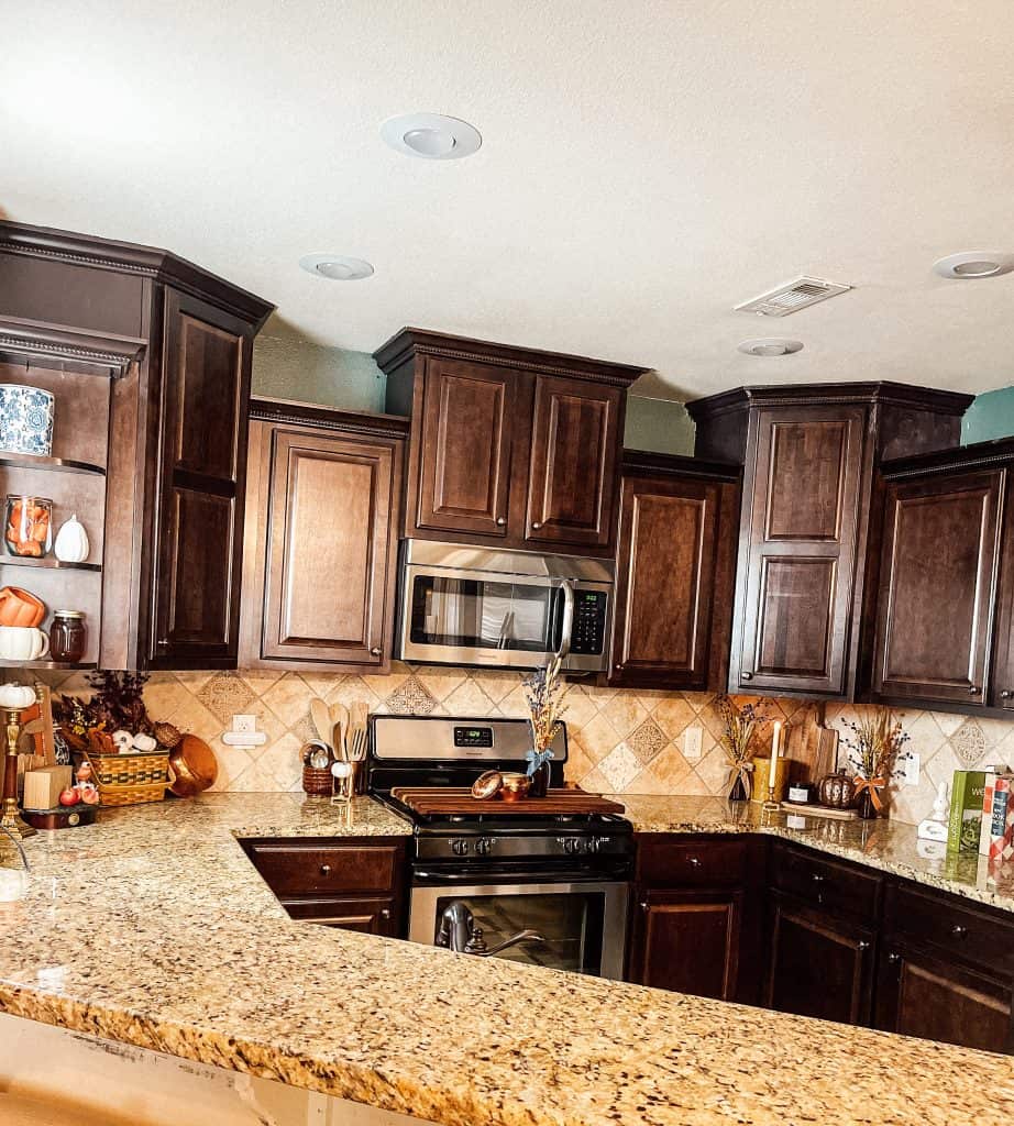 small kitchen with dark cabinets decorated for fall