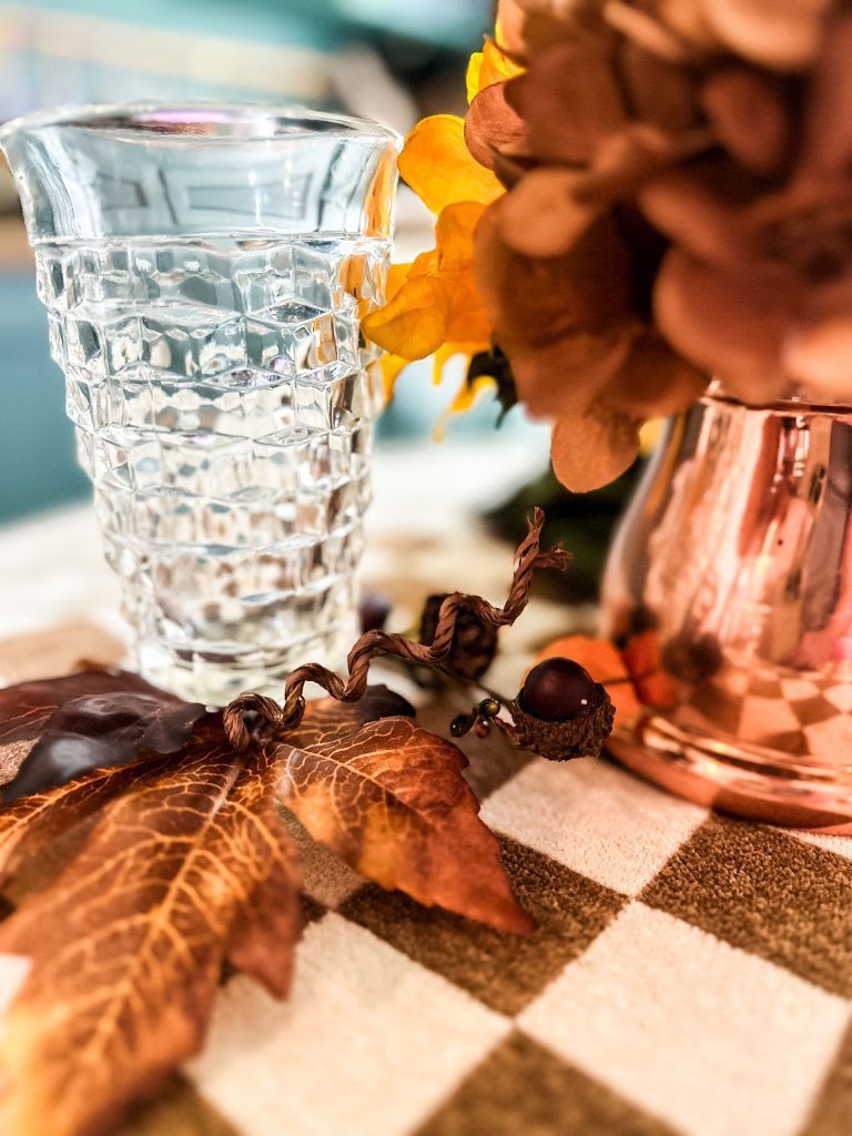 vintage honeycomb glassware on a table with leaves