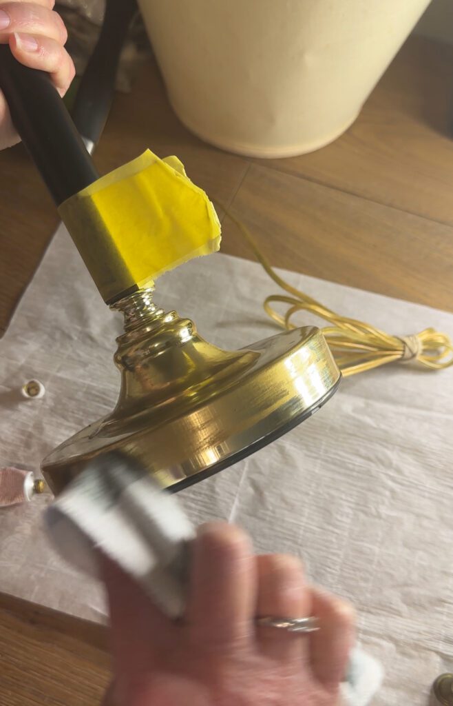 thrifted lamp being painted