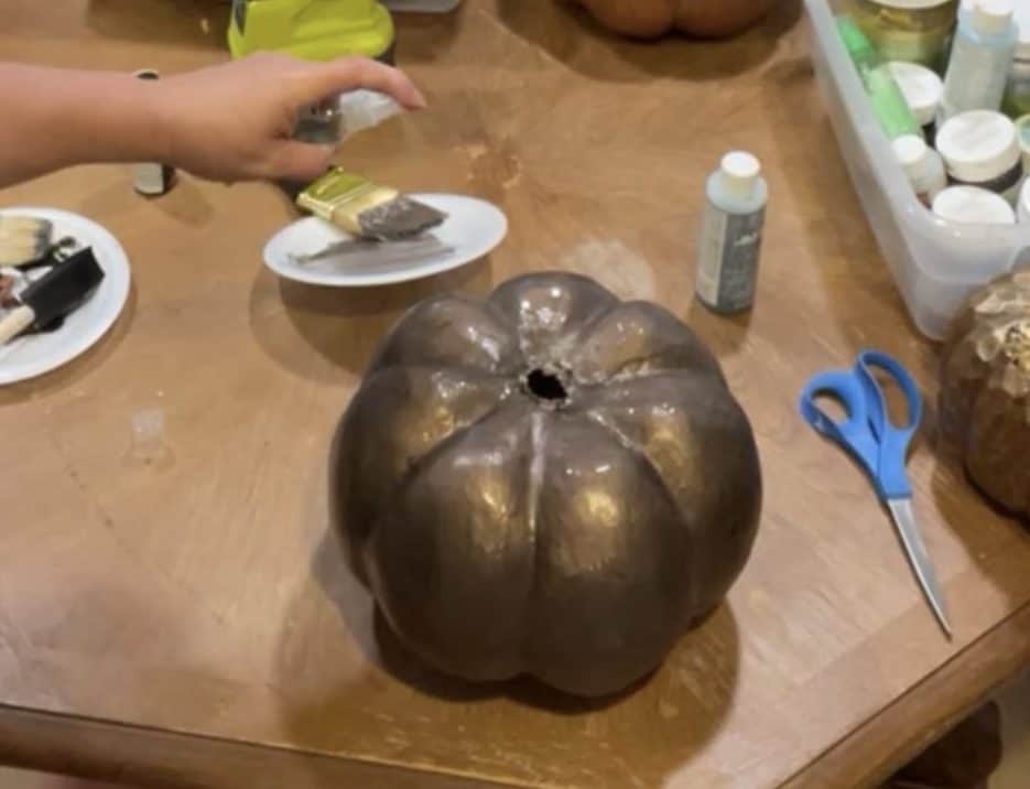Adding patina solution to pumpkins
