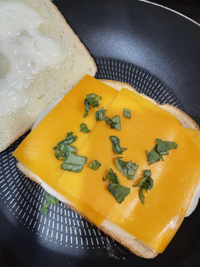 "Gourmet" grilled cheese with fresh torn basil was the perfect compliment to this deliciously creamy tomato basil soup