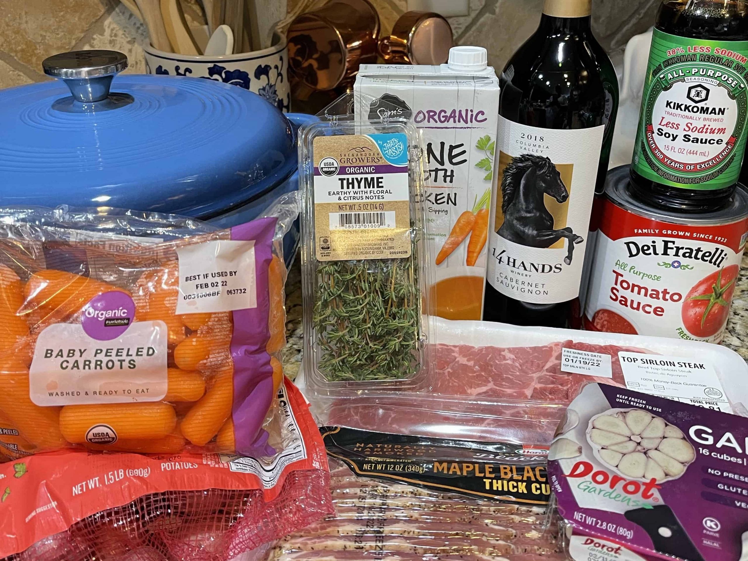 My Beef Bourguignon Instant Pot Ingredients: baby carrots, garlic, soy sauce, thyme, tomato sauce, chicken broth, beef, bacon